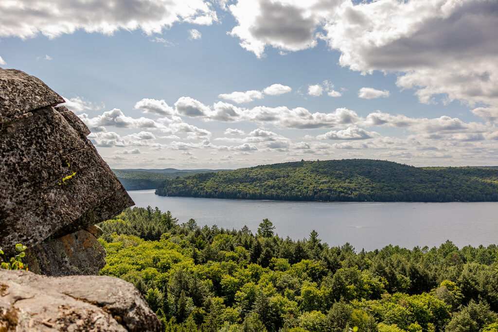 View from Booth's Rock lookout in Algonquin Provincial Park showing Rock Lake and surrounding forest.